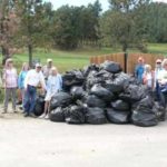 a huge pile of black trash bags